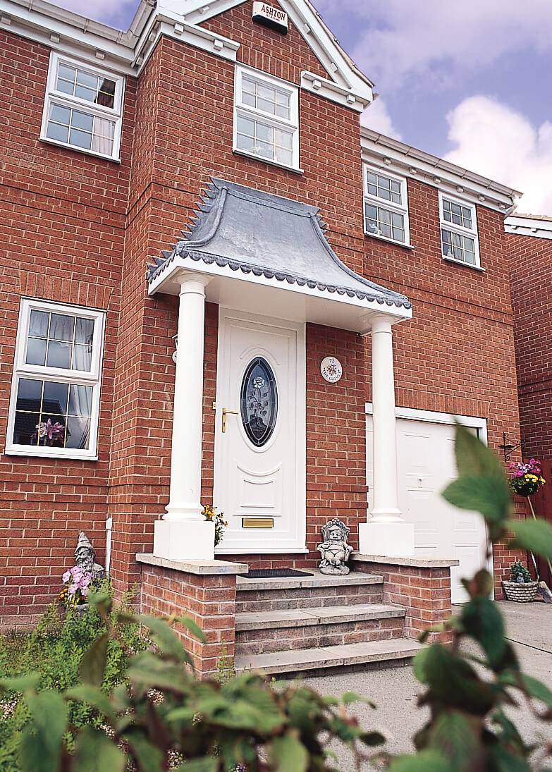 House with white sliding sash windows and white entrance door
