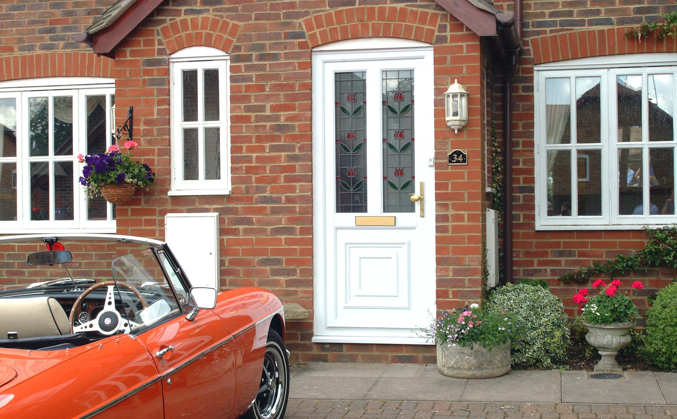 White uPVC door with classic sports car
