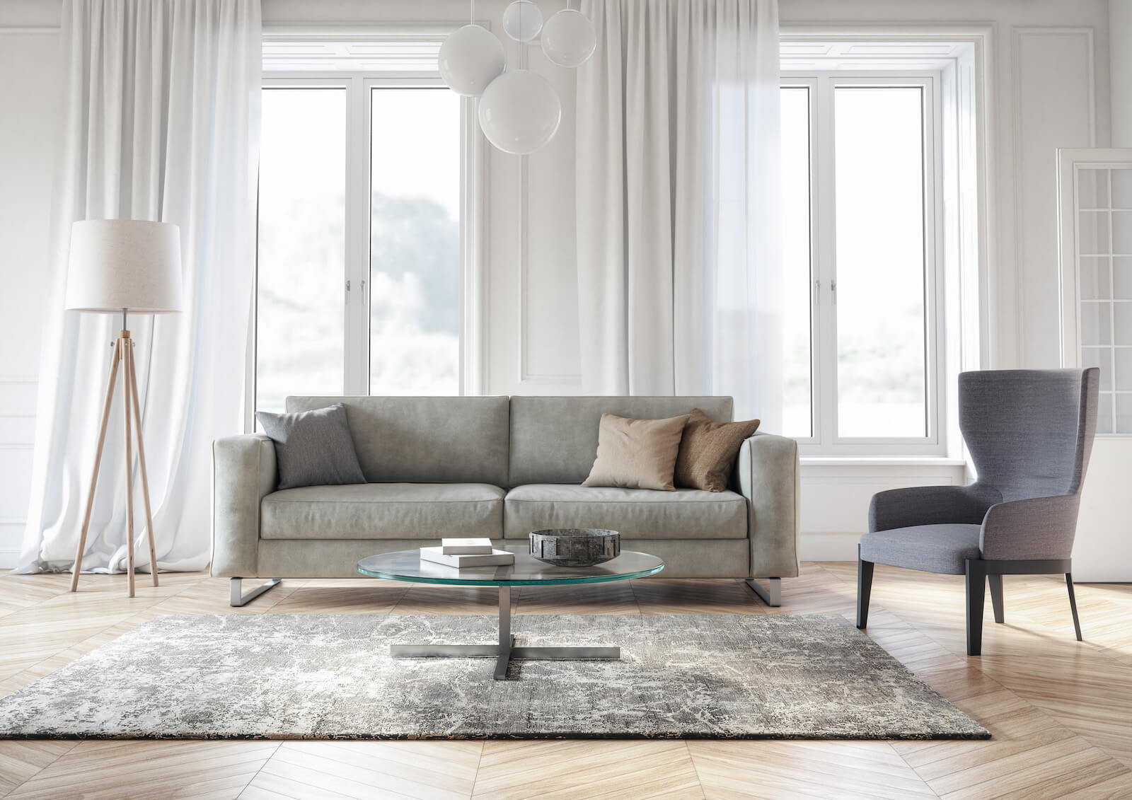 Modern living area with grey sofa and white interior